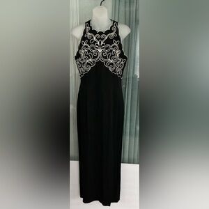 Scott McClintock black sleeveless maxi dress with white embroidered
detailing.